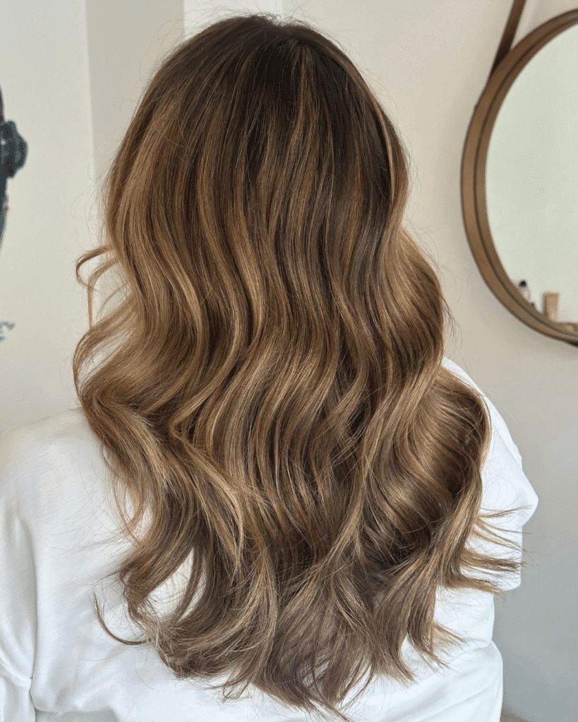 Hair color NYC warm brunette wavy hair Color And Andy salon Bowery